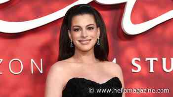 Pregnant Anne Hathaway shows off blossoming bump in strapless glitzy dress