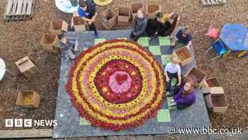Children recycle flower 'carpet' into mini artwork