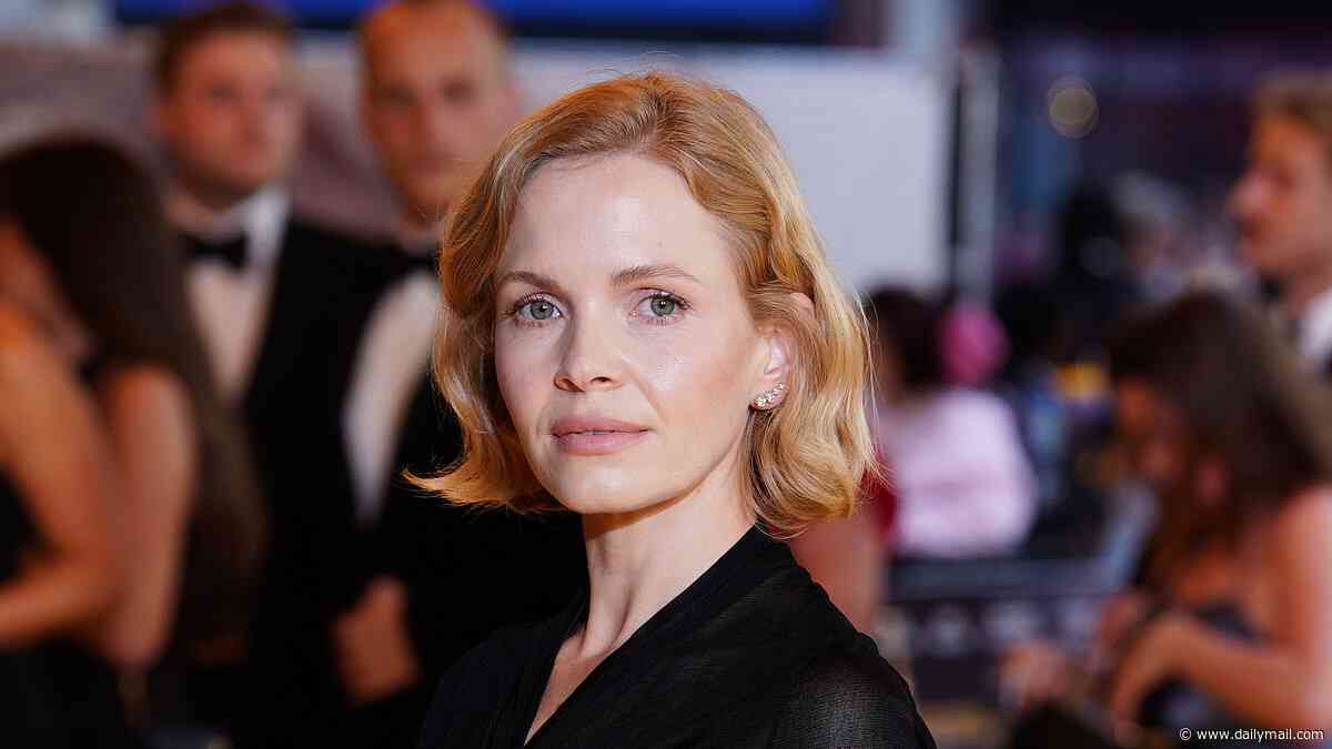 Peaky Blinders star Kate Phillips exudes glamour in an elegant black two-piece as she joins chic co-star Miranda Richardson at The Yellow Tie premiere
