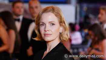 Peaky Blinders star Kate Phillips exudes glamour in an elegant black two-piece as she joins chic co-star Miranda Richardson at The Yellow Tie premiere