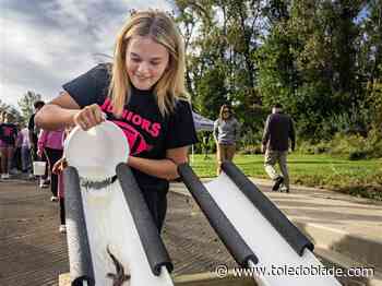 Area students find joy in baby lake sturgeon release near Fremont