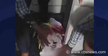 Passenger videos show aftermath of alleged pilot stabbing on flight to Israel: "We need help"