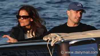 Katie Holmes, 47, looks giddy as she drinks wine and cuddles with toyboy Jason Bard Yarmosky, 39, on Lake Como