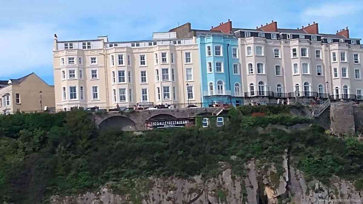 Criticism over 'unacceptable' sign on cliff face at Tenby beach
