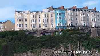 Criticism over 'unacceptable' sign on cliff face at Tenby beach