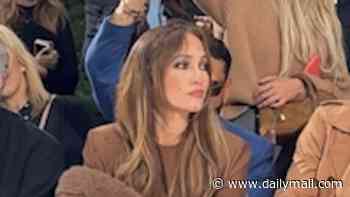 Jennifer Lopez is fuming as staff confiscate her umbrella while sitting in the pouring rain on the front row at the Stella McCartney show in Paris