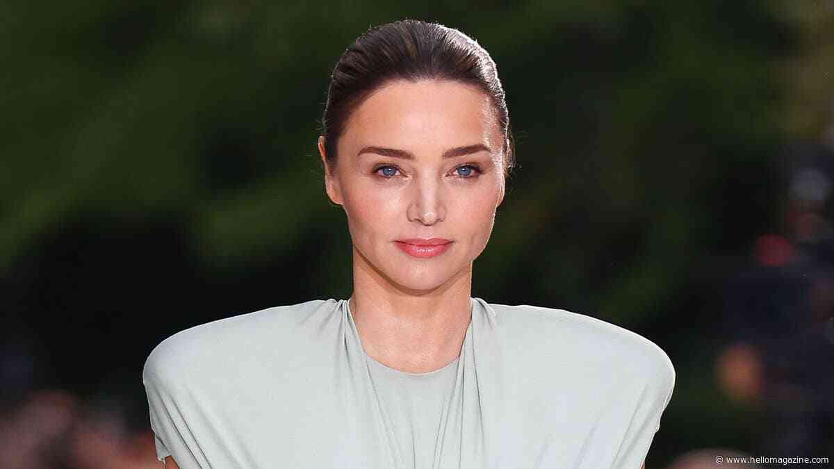 Miranda Kerr's rock-hard abs steal the show as the makes unexpected return to the runway
