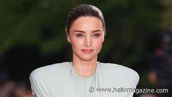 Miranda Kerr's rock-hard abs steal the show as the makes unexpected return to the runway