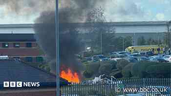 Bin lorry dumps flaming load on to street