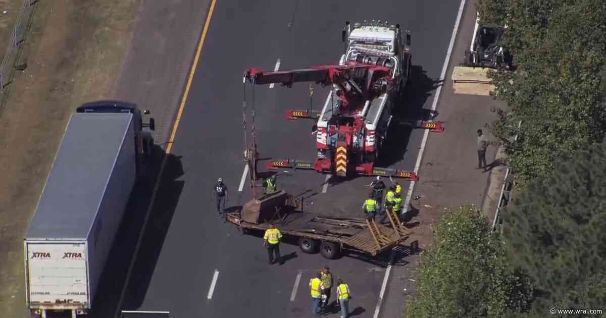 Trailer blocks lanes on I-540 near Falls of Neuse Road, creating major delays