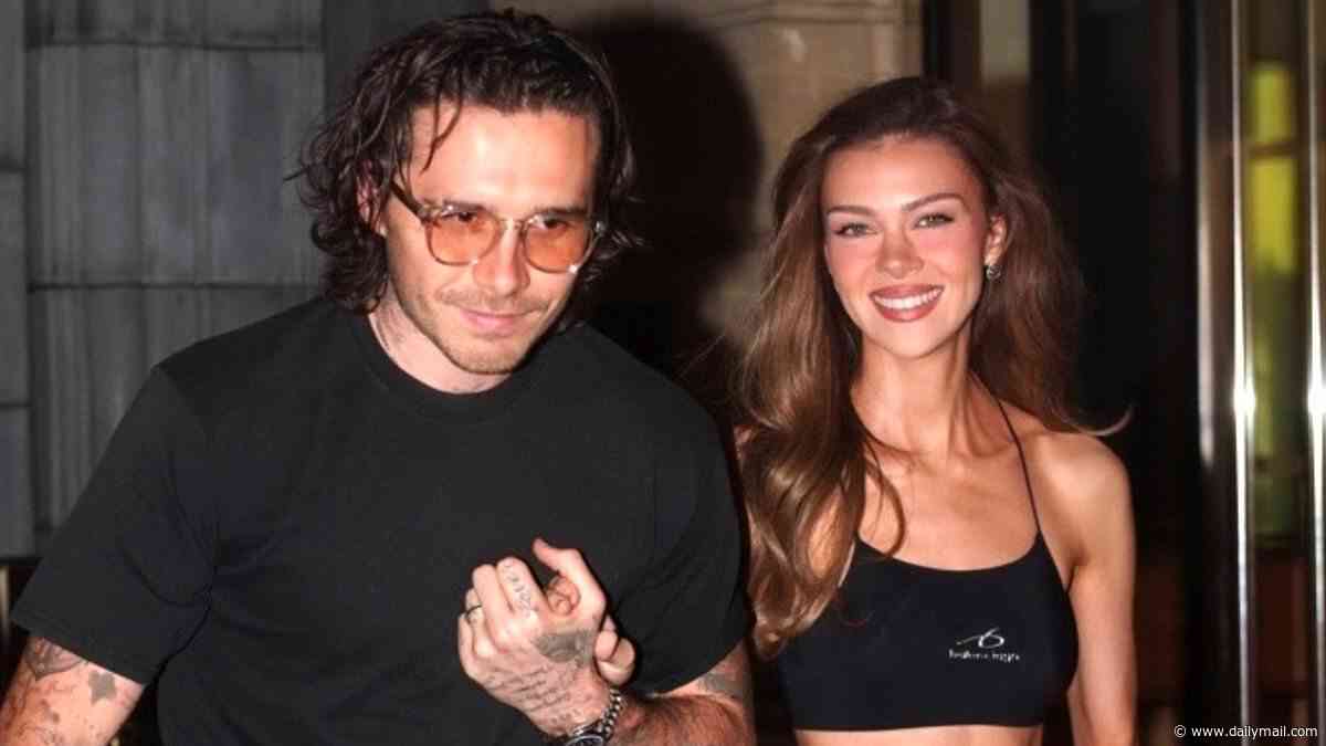 Nicola Peltz flashes toned midriff in a black crop top as she puts on a loved-up display with husband Brooklyn Beckham at Messika's PFW event - ahead of Victoria's runway show