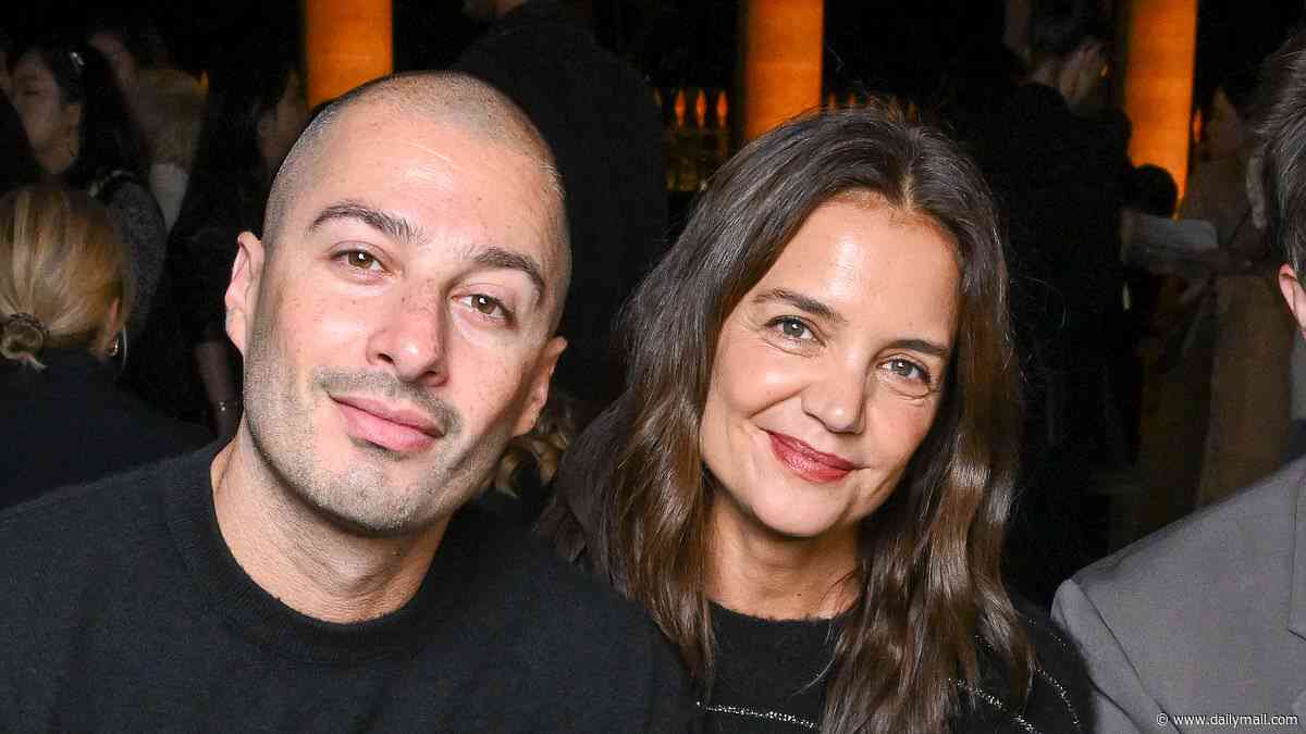 Katie Holmes and boytoy Jason Bard Yarmosky hold hands at Isabel Marant show for Paris Fashion Week