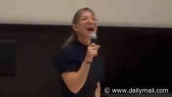 Moment October 7 survivor whose husband died jumping on a grenade to protect his sons is booed off stage during protest at anti-IDF film premiere