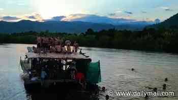 Adventure travel firm is sued for £12million by customer after she was trapped in a capsized river boat on 'sunset BBQ cruise' in Cambodia