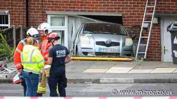 Car ploughs into house in Mossley crash as woman rushed to hospital