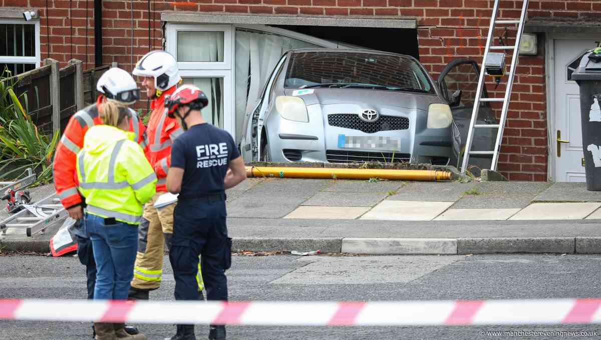 Woman hospitalised after car crashes into house in Mossley