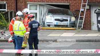 Woman hospitalised after car crashes into house in Mossley