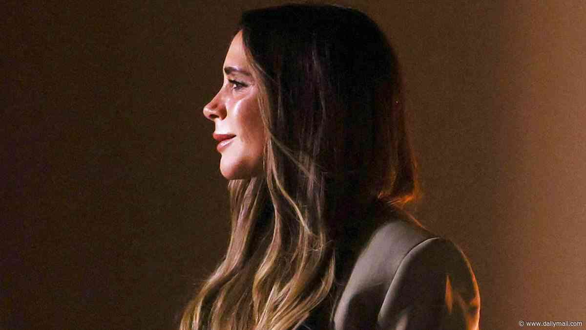Victoria Beckham looks emotional as she closes her Paris Fashion Week show while David and the family support from the front row but their estranged son Brooklyn snubs event following the footballer's olive branch
