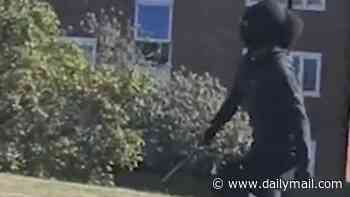 Moment masked teenager chases after a terrified student with a machete before the college is put into lockdown as police continue hunt for knifeman