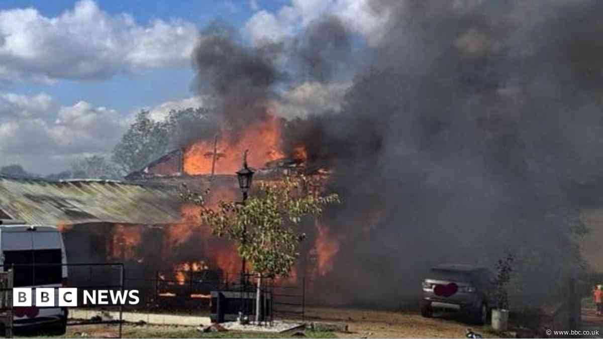 Garage fire destroys home, workshop and cars