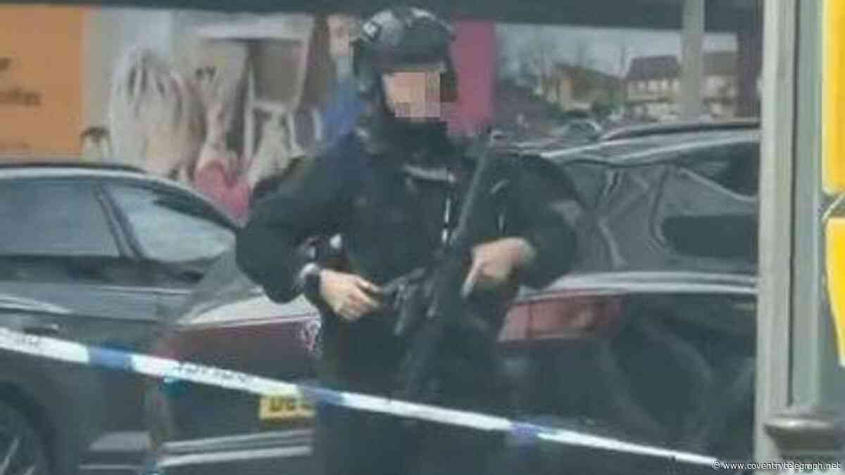 Manhunt as armed police find dead dog after woman attacked