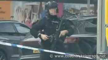 Manhunt as armed police find dead dog after woman attacked