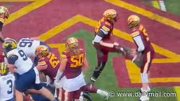 Wild moment college football player kicks his own quarterback in the groin as celebration goes horribly wrong