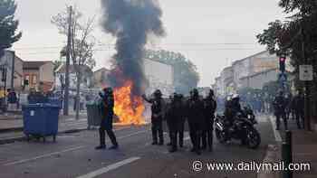 Boy, 15, held for burning woman with makeshift flame-thrower in riots