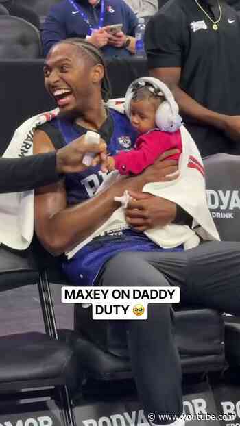 Daddy duty.. Tyrese grabs his daughter Marvel to the bench