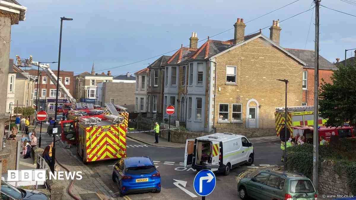 Road reopens after fire at block of flats