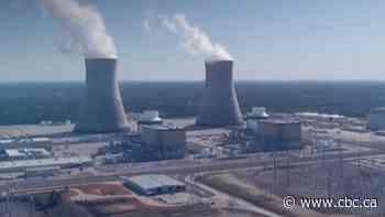 How would 2 large nuclear reactors affect Saskatchewan's economy and land?
