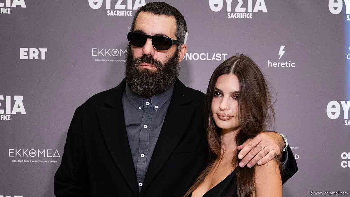 Emily Ratajkowski stuns in a plunging semi-sheer dress as she cosies up to director boyfriend Romain Gavras at the premiere of his new film Sacrifice
