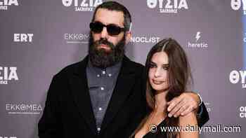 Emily Ratajkowski stuns in a plunging semi-sheer dress as she cosies up to director boyfriend Romain Gavras at the premiere of his new film Sacrifice