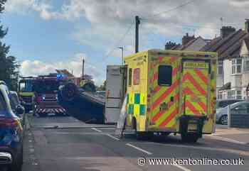 Car overturns in residential road near school
