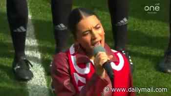 Canadian national anthem descends into chaos as singer forgets the words and starts giggling... before crowd boo her: 'Should get her passport stripped'