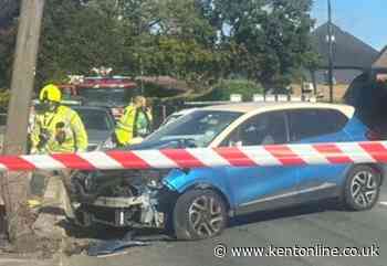 Road closed as emergency services called after car crashes into pole