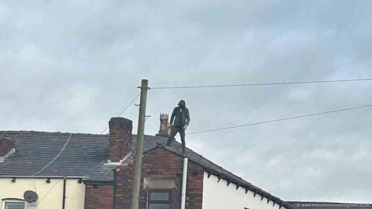 Hindley rooftop stand-off RECAP as police surround row of terraced houses