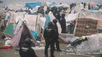 Spanish police clear Ceuta beach where 3,000 migrants had set up camp ahead of visit by royal family