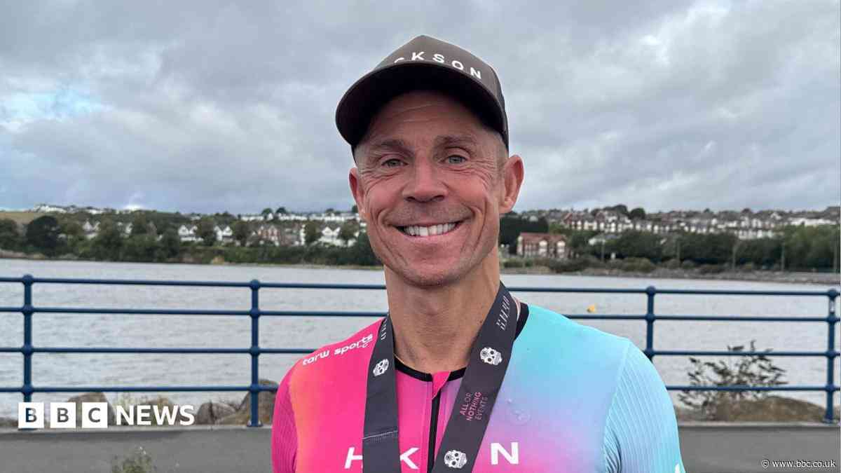 Triathlete was 'very sick' in hospital after swimming in 'dirty' open water