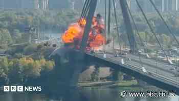 Kyiv bridge hit in further Russian drone attack as German chancellor makes surprise visit