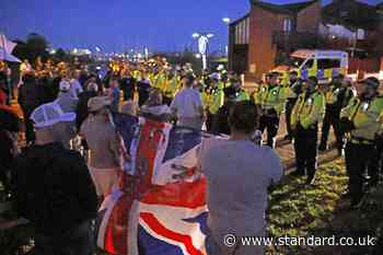 Protesters gather as migrant dinghy heads for south coast