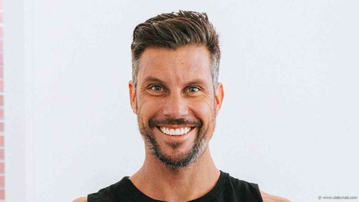 The Bachelor star Sam Wood stood down indefinitely from fitness empire after being charged with domestic violence offences as he remains behind bars