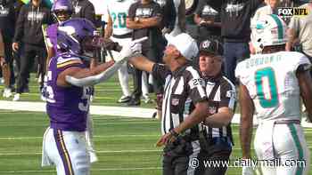 NFL referee screams at Vikings player Eric Wilson after he was knocked to the turf in bruising collision