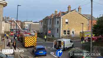 Road reopens after fire at block of flats