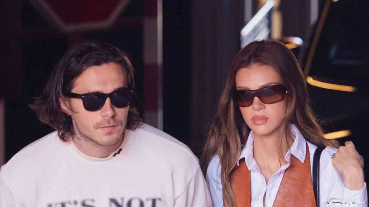 Brooklyn Beckham shares a poignant message as he steps out in Paris wearing an 'it's not clocking to you' slogan tee after snubbing Victoria's show