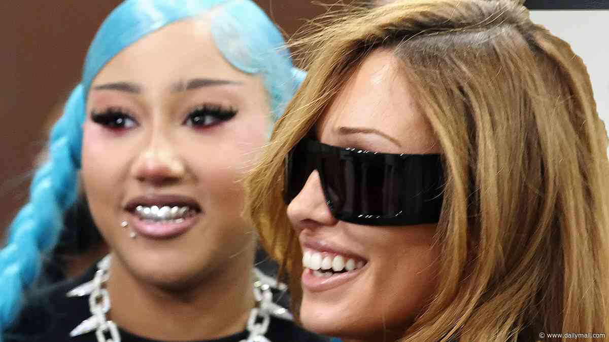 Kim Kardashian and Kanye West's daughter North, 13, turns heads with metal grills, fake piercings and bold blue hair as she poses with stepmom Bianca Censori at ComplexCon