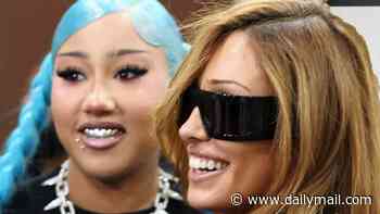Kim Kardashian and Kanye West's daughter North, 13, turns heads with metal grills, fake piercings and bold blue hair as she poses with stepmom Bianca Censori at ComplexCon