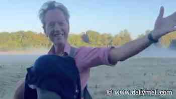 Richard E. Grant carries his sleeping grandchild on his chest in an adorable video after 'iconic' Celebrity Traitors debut