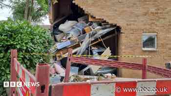 Man rescued after car crashes into house