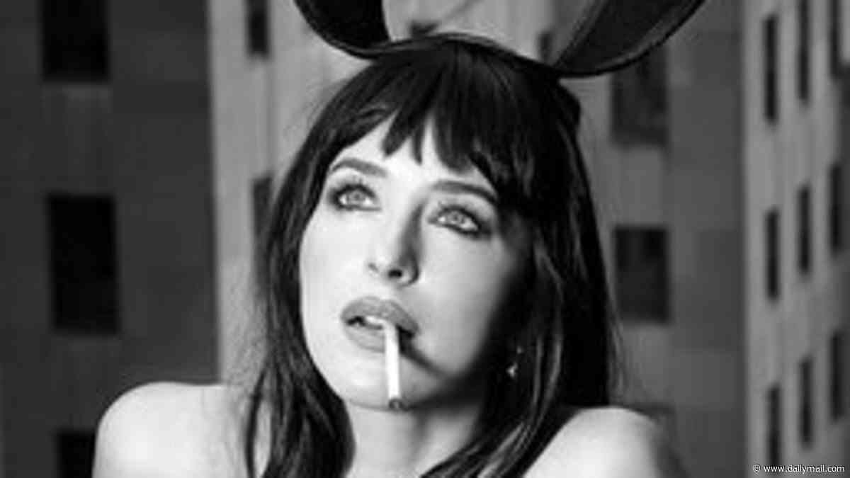 Dakota Johnson wears a corset and suspenders as she poses in a Playboy bunny costume while smoking a cigarette
